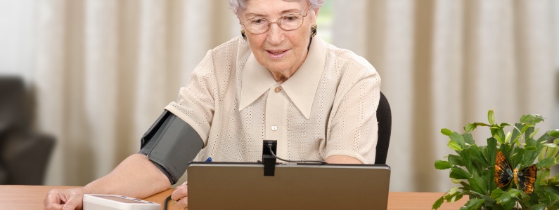Woman taking her own blood pressure.