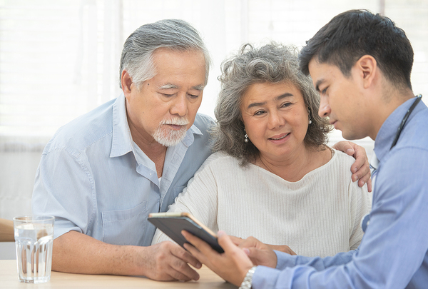 couple reviewing information with doctor