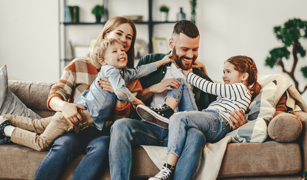 family playful on couch