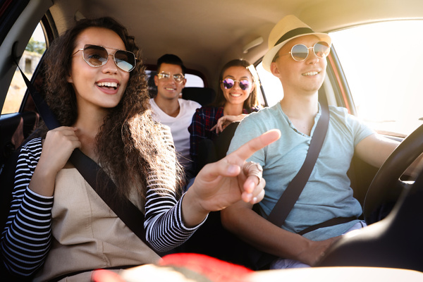 Two couples in travelling in car