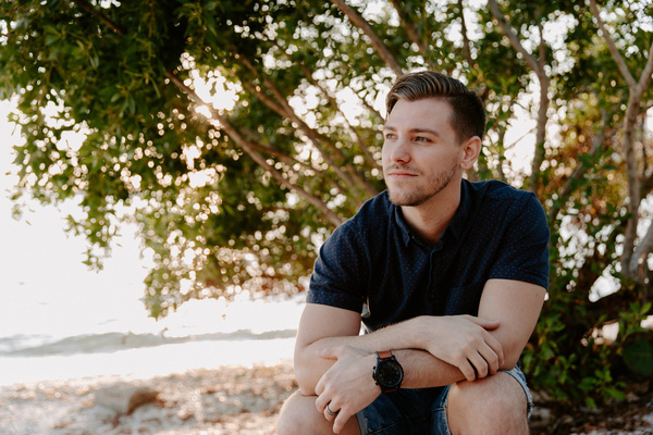Man sitting looking into distance